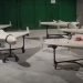 Four drones on stands, in a hangar.