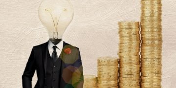 Currency coins and a light head depiction Festival of Economics