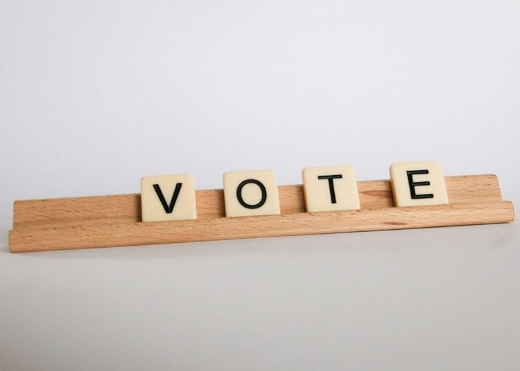 the word vote in scrabble pieces
