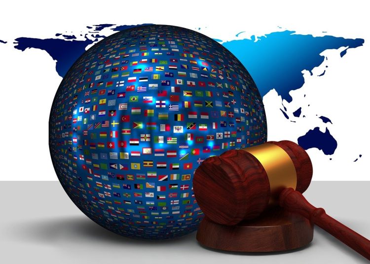 A globe with a justice hammer representing ICC ruling
