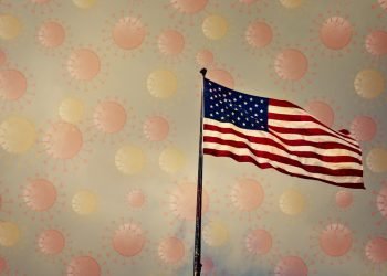US american flag and virus particles in the air representing post vaccination US