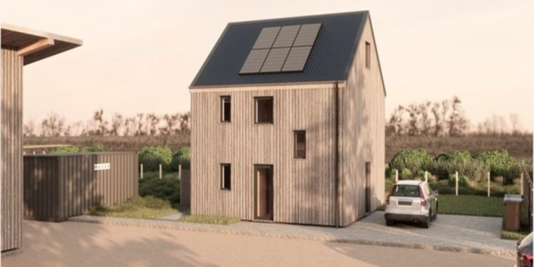 An image of a home with a wooden facade and solar panels on the roof.