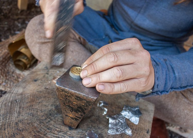 Minting of decorative coins at viking market representing a process that would lead to Chartalism