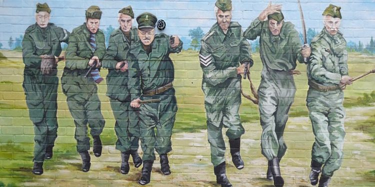 A mural painting on a brick wall of the cast of the British television series from the 1970s of Dad's Army.
