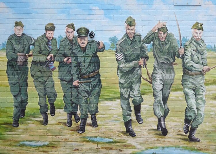 A mural painting on a brick wall of the cast of the British television series from the 1970s of Dad's Army.