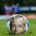 A football pitch with Farage and ball depicting Match of the Day political satire