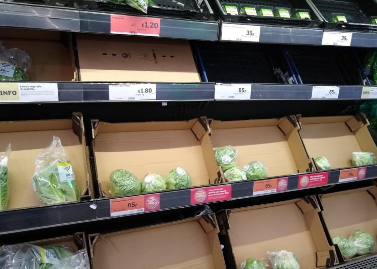 A supermarket food shelf of fresh lettuce with low stock