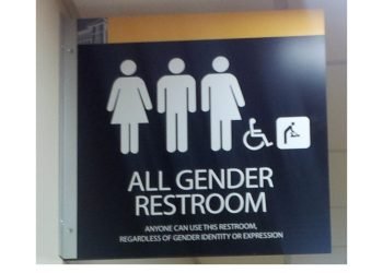 Picture on toilet door shows it is for any and all genders, disabled and baby changing